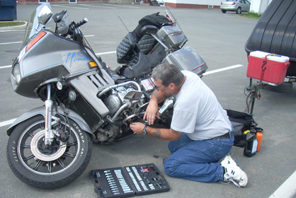 Ernie Dube Changes a starter on his goldwing in the parking lot - www.Motorcycles123.com