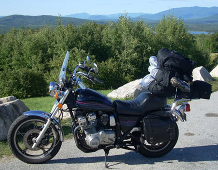 Suzuki motorcycle with camping gear - www.MotorCycles123.com