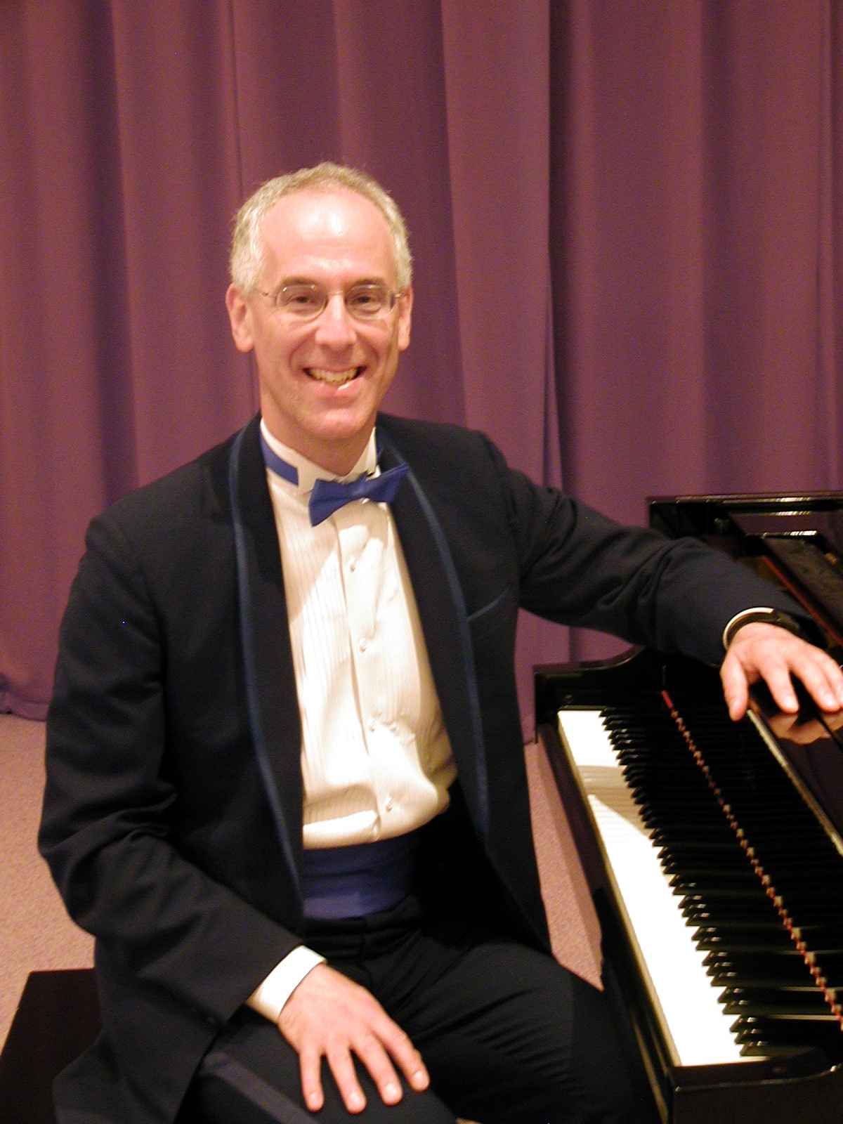 Phil Mandel at the piano - www.seniorsentertainer.com